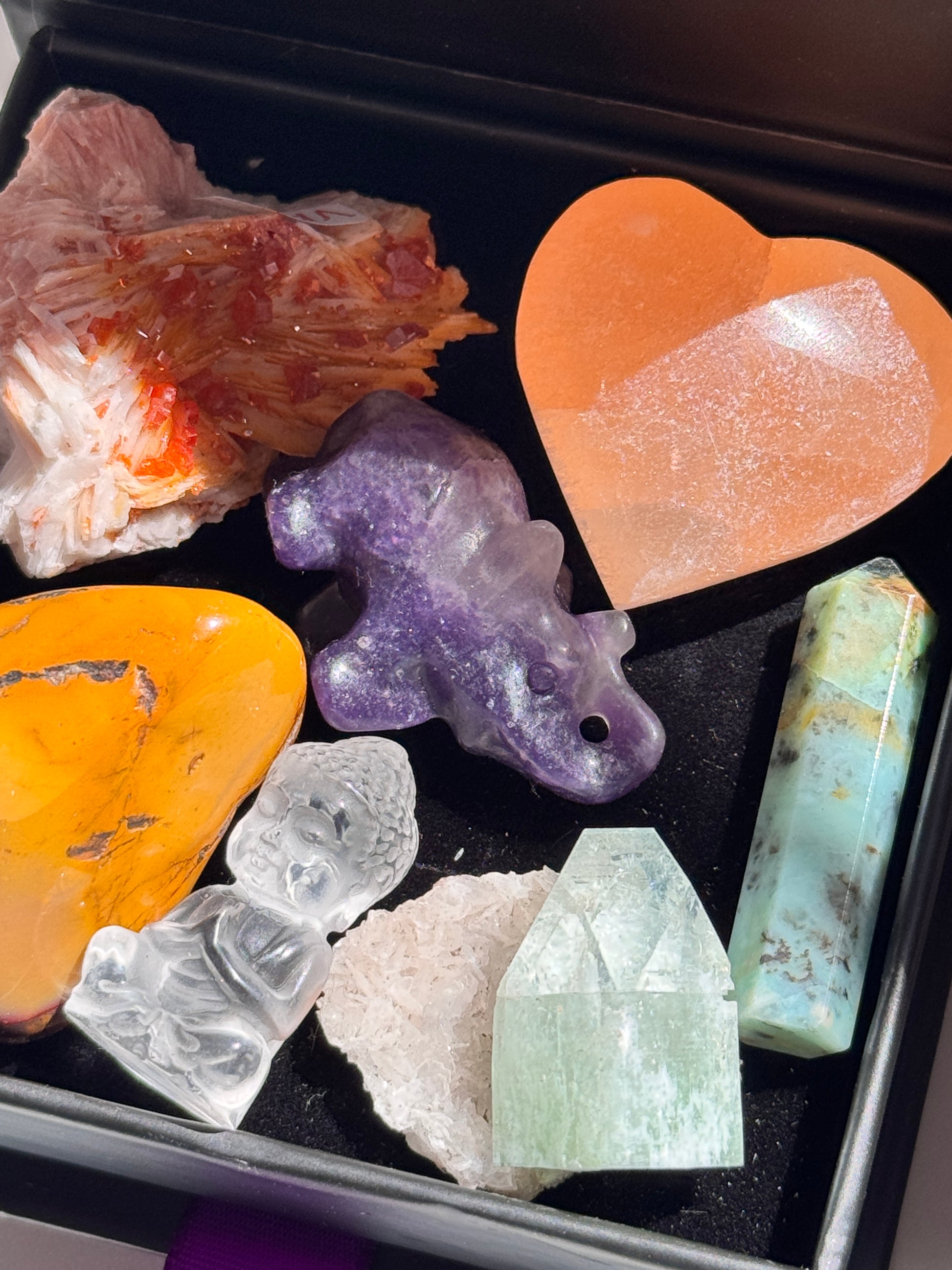 Packaged in a luxe magnetic keepsake box, this set includes:
Vanadinite (Root Chakra): A bold burst of grounding and creative drive
Orange Selenite Heart (Sacral Chakra): Gentle flow, sensuality, and emotional nourishment
Mookaite Jasper Tumble (Solar Plexus Chakra): Vitality, self-trust, and personal strength
Green Apophyllite (Heart Chakra): Heart-softening clarity and love-energy activation
Chrysoprase Tower (Throat Chakra): Truthful expression and inner renewal
Lepidolite Elephant (Third Eye Chakra)