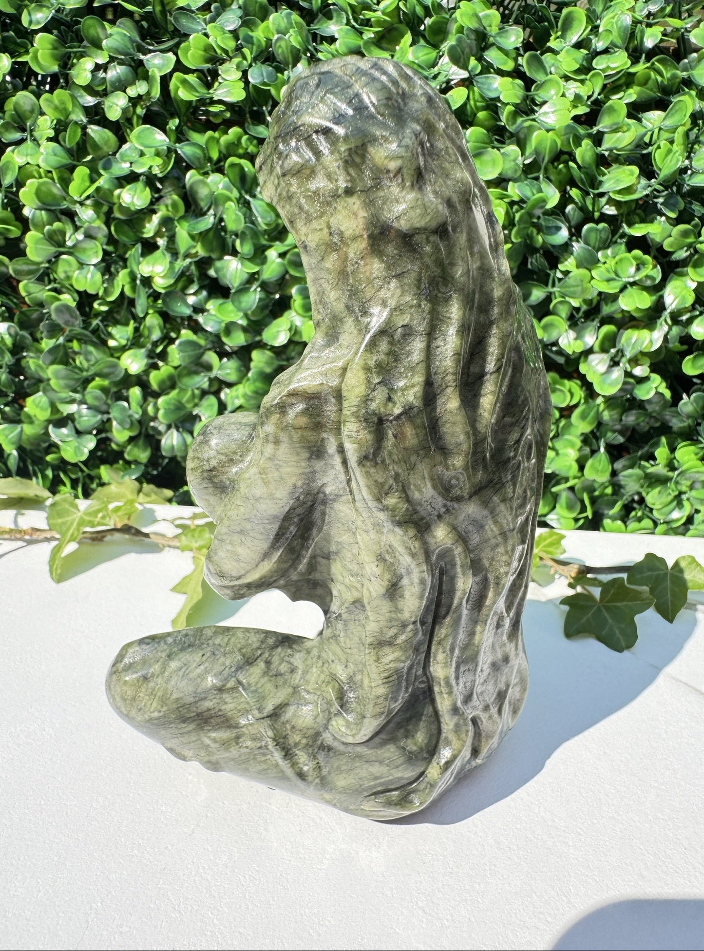 Jade carving, back of carving of breastfeeding mother and child