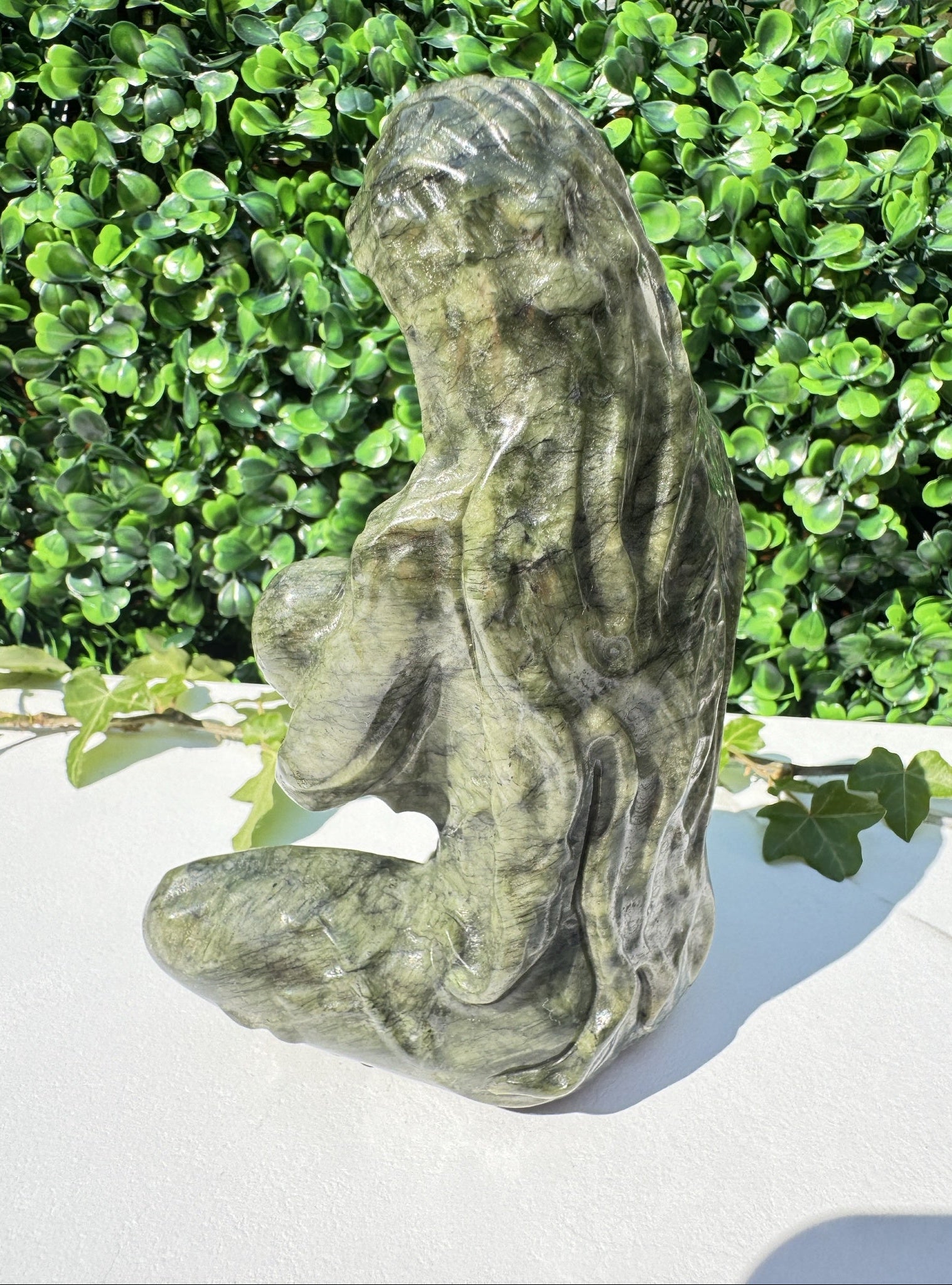 Jade carving, back of carving of breastfeeding mother and child