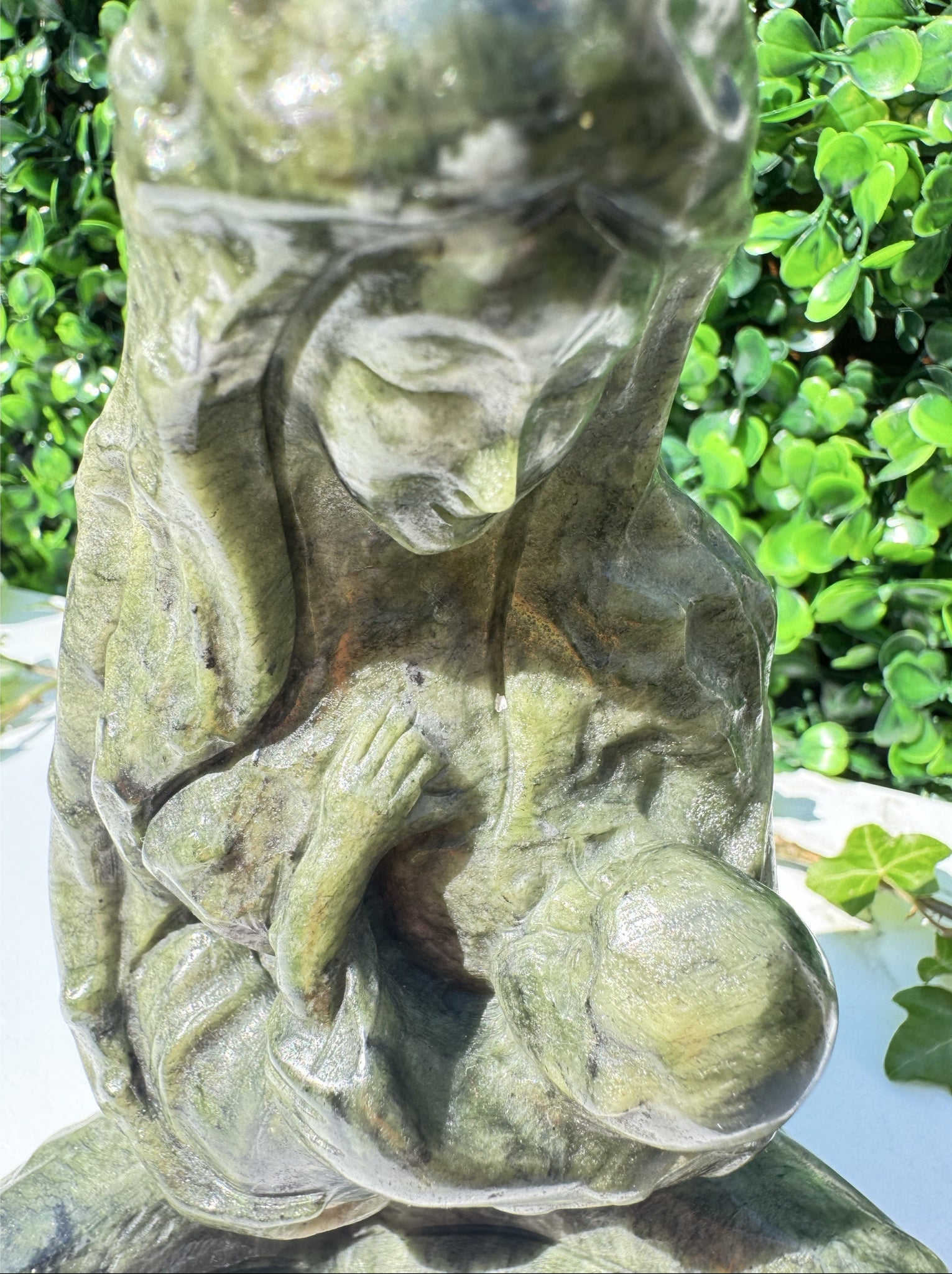 Jade carving, close up of breastfeeding mother and child